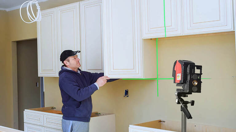 How To Install Cabinets With A Laser Level, Leveling Base Cabinets